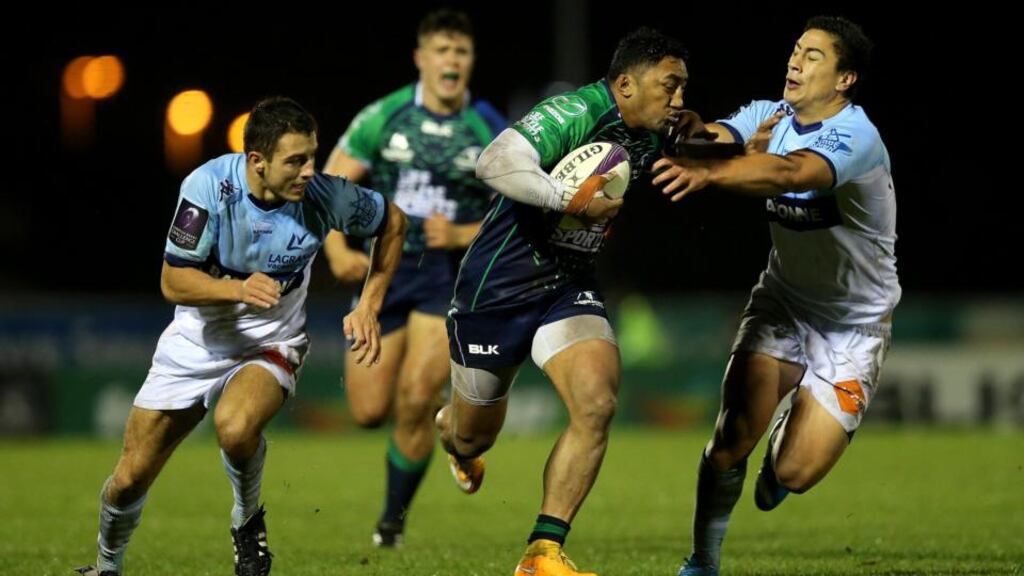 Connacht’s Bundee Aki fends off the attempted challenge of Bayonne’s with Lalakai Foketi during the European Rugby Challenge Cup match at The Sportsground. Photograph: Ryan Byrne/Inpho