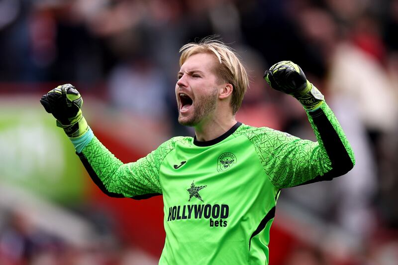 Caoimhín Kelleher celebrates team-mate Mathias Jensen's goal for Brentford against Manchester United. Photograph: Justin Setterfield/Getty Images