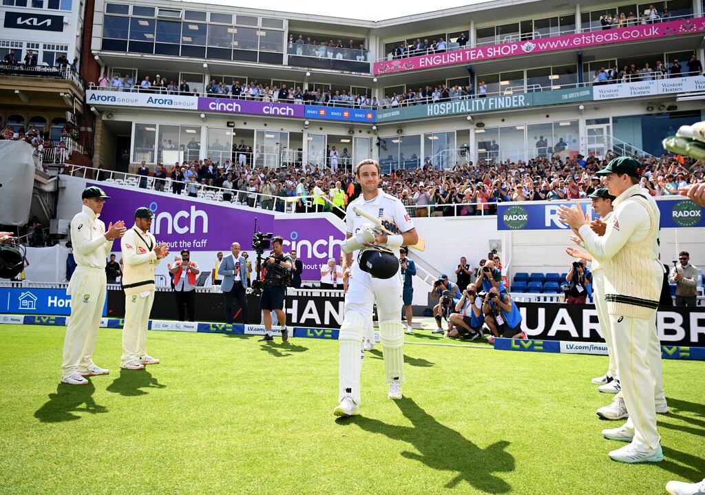 England's Stuart Broad walks out to bat through a guard of honor of Australian players after announcing his retirement from cricket prior to day four of the fifth Test at the Oval. Photograph: Gareth Copley/Getty Images