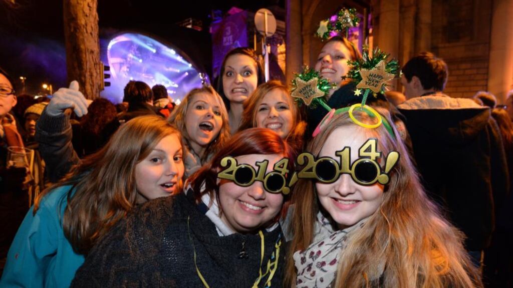 ‘On New Year’s Eve you are supposed to be invited to a party. But lots of people aren’t. For decades, I have spent New Year’s Eve watching television, which celebrates by showing exceptionally terrible programmes followed by images of people singing Auld Lang Syne in Scotland and London.’ Above, celebrations at midnight at the Three NYE, New Year’s Eve Dublin Countdown Concert at College Green, Dublin, last year. Photographer: Dara Mac Dónaill / The Irish Times