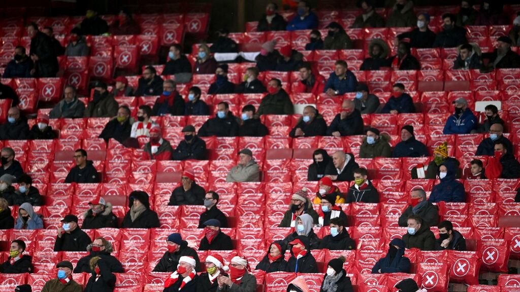 A file photo of socially distanced Arsenal fans in the stands during a Premier League match at Emirates Stadium last year. Photo: Laurence Griffiths/PA Wire