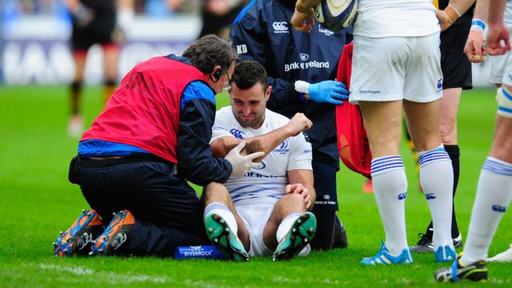 Leinster player Dave Kearney receives treatment in the first minute of the game after being upended by Wasps flanker Ashley Johnson at the Ricoh Arena. Photograph: Stu Forster/Getty Images