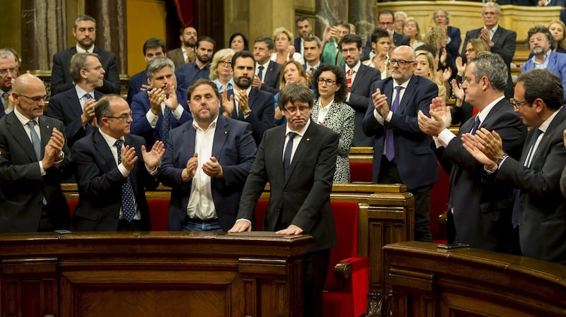 Catalan president Carles Puigdemont is applauded after addressing the region’s parliament in Barcelona. Photograph: Quique Garcia/EPA