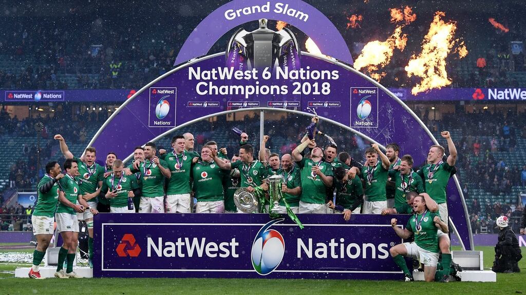 The Ireland team celebrate with the NatWest Six Nations trophy and the Triple Crown trophy after their match against England at Twickenham. Photograph: Laurence Griffiths/Getty Images