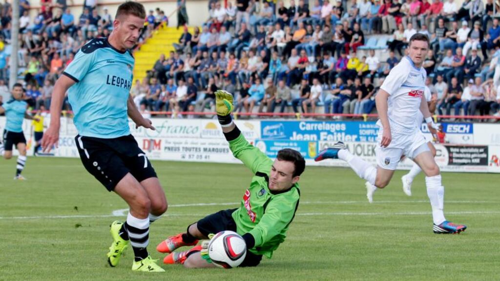 UCD goalkeeper Niall Corbet dives at the feet of David Turpel of Dudelange during the Uefa Europa League first qualifying round, second Leg match at Stade Jos Nosbaum in Dudelange, Luxembourg. Photograph: Fabrizio Munisso/Inpho