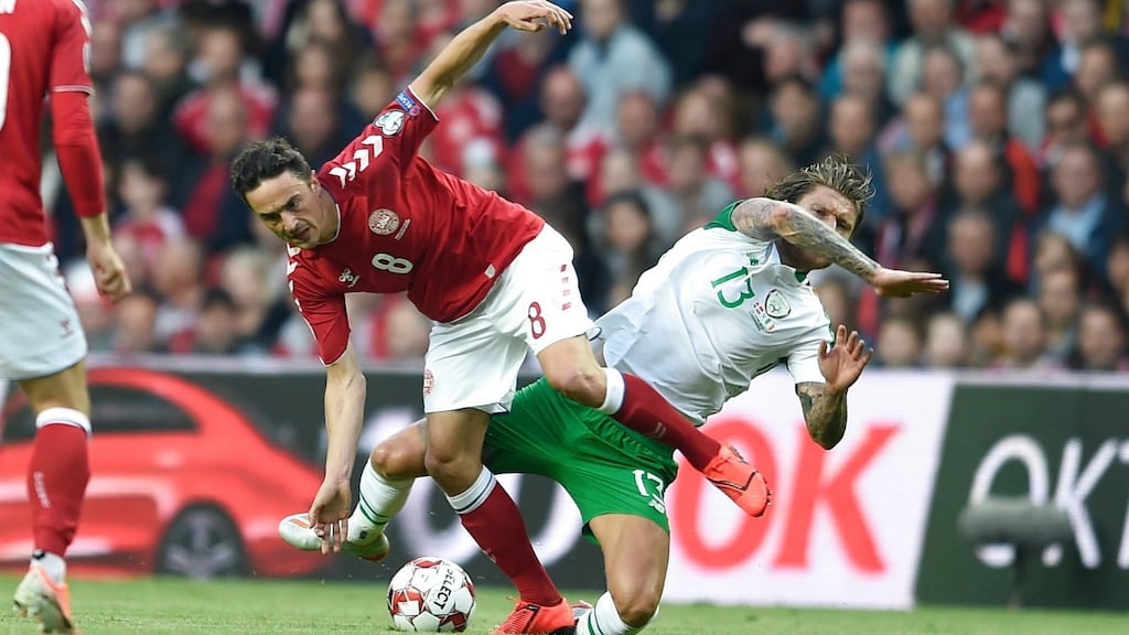 Denmark’s Thomas Delaney and Jeffrey Hendrick battle for the ball. Photo: Liselotte Sabroe/Getty Images