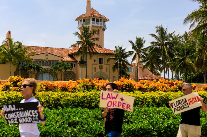 Protesters against former president Donald Trump at his Mar-a-Lago residence in Palm Beach. (Saul Martinez/The New York Times)