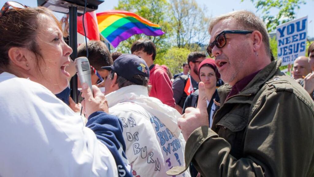 Rev Scott Hopkins of the United Methodist Church, in Vienna, Virginia, voices his support of gay marriage as Tracy Grisham, of Amarillo, Texas, shouts her disapproval. Photograph: John Boal/EPA