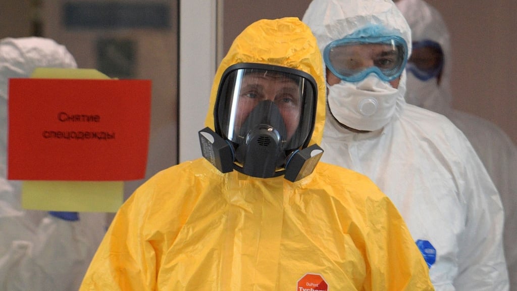 Russian president Vladimir Putin wearing protective gear visits a hospital where patients infected with the Covid-19 novel coronavirus are being treated in the settlement of Kommunarka in Moscow. Photograph: Alexey Druzhinin/Sputnik/AFP