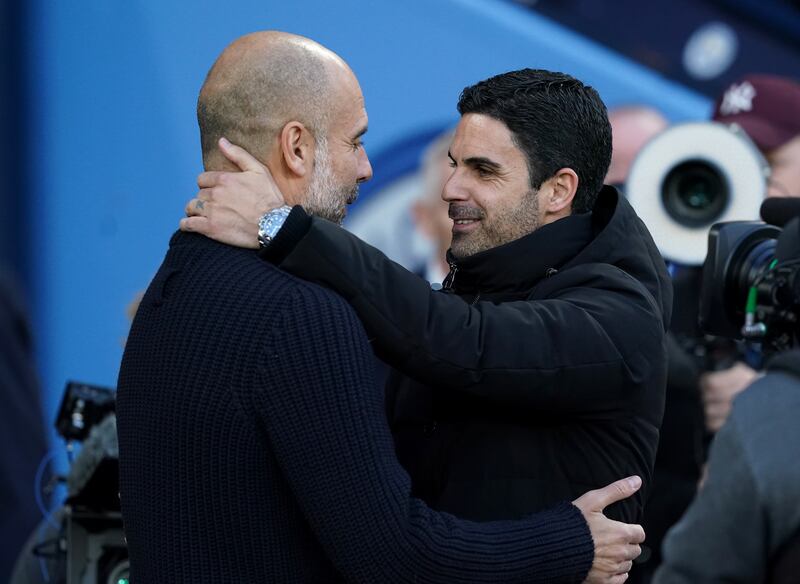 Manchester City manager Pep Guardiola and his Arsenal counterpart Mikel Arteta embrace before their clash at the Etihad Stadium, Manchester in April 2023. Photograph: Martin Rickett/PA