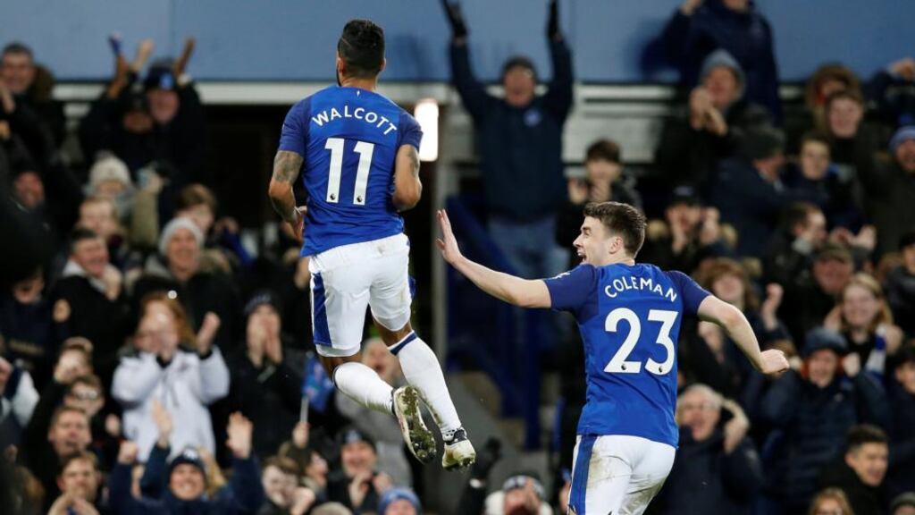 Séamus Coleman celebrates with Theo Walcott after he scored his second goal in the Premier Division game against Leicester City at Goodison Park. Photograph: Andrew Yates/Reuters