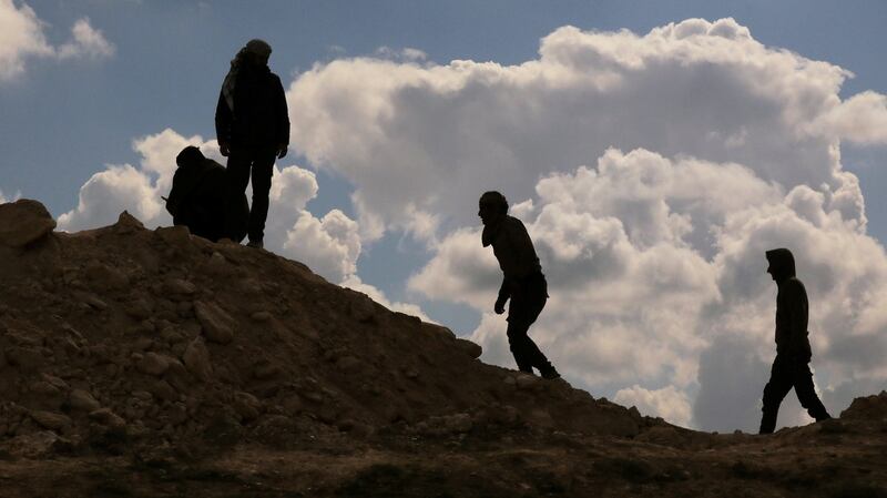 Fighters from the Syrian Democratic Forces walk positions in the village of Baghouz, Deir Al Zor province, Syria. Photograph: Reuters