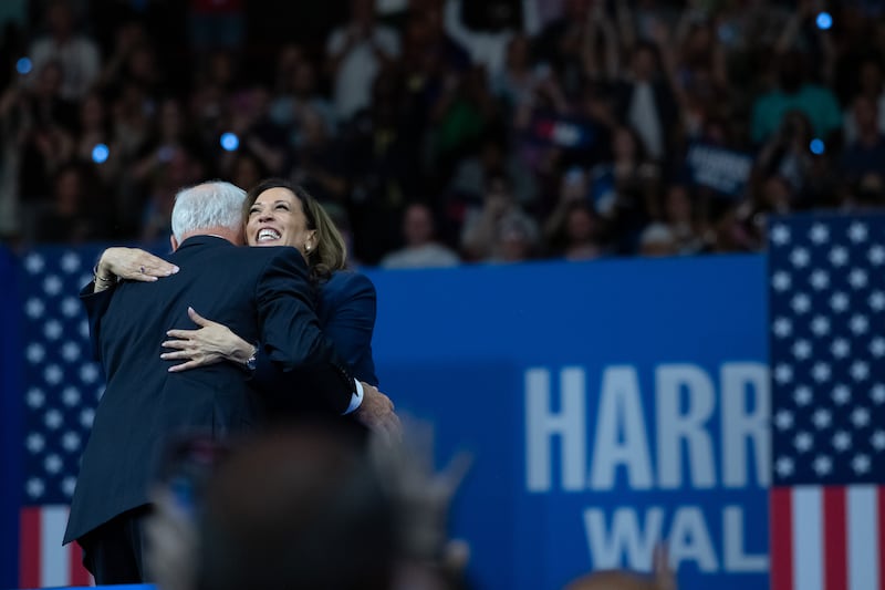 Democratic presidential candidate Kamala Harris (R) hugs her new running mate, Minnesota gov Tim Walz (L), at the Liacouras Center at Temple University in Philadelphia, Pennsylvania. Photograph: EPA-EFE