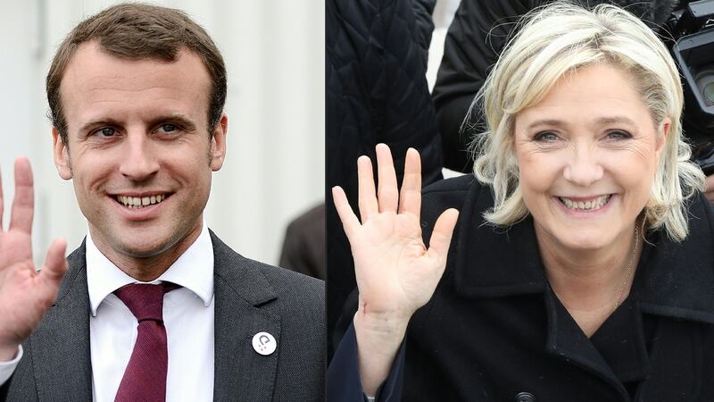 Centrist candidate Emmanuel Macron and far-right leader Marine Le Pen, who go head-to-head in the second round of France’s presidential election on May 7th, are diametrically opposed on issues ranging from taxes to Europe. Photograph: Jean-Sebastien Evrard and Valery Hache/Getty Images