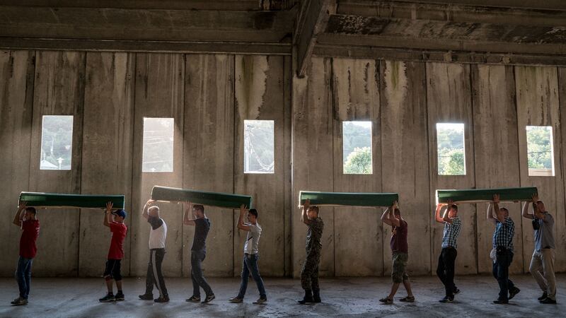 Coffins of the victims of the Srebrenica massacre are taken from a former battery factory in Potocari, near Srebrenica, on July 10th, 2016, to be buried at a nearby cemetery. Photograph: Andrew Testa/New York Times
