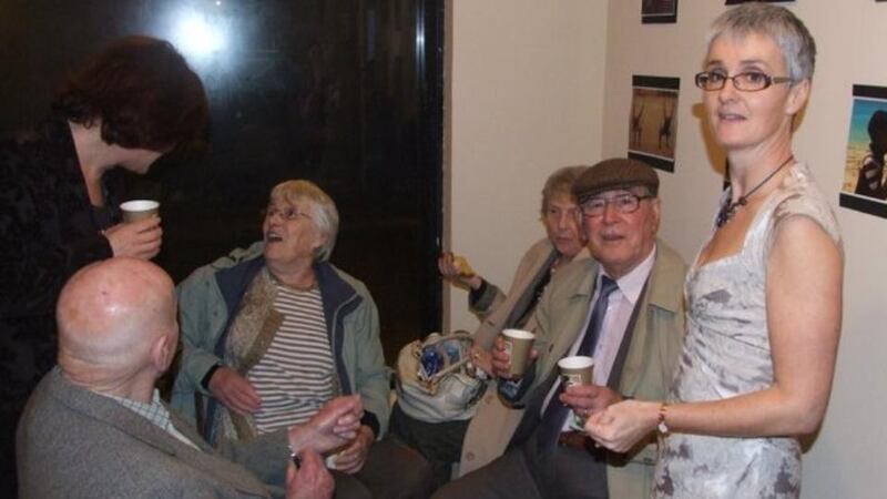 Anne Tannam, standing, and her mother Betty, third left, at the launch of her first collection