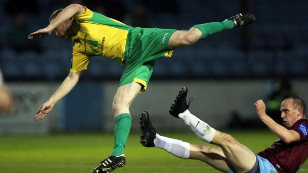 Drogheda United’s Alan Byrne (right) tackles Shaun McGowan of Finn Harps during their FAI Cup quarter-final replayin Hunky Dorys Park, Drogheda. Photograph: Donall Farmer/Inpho