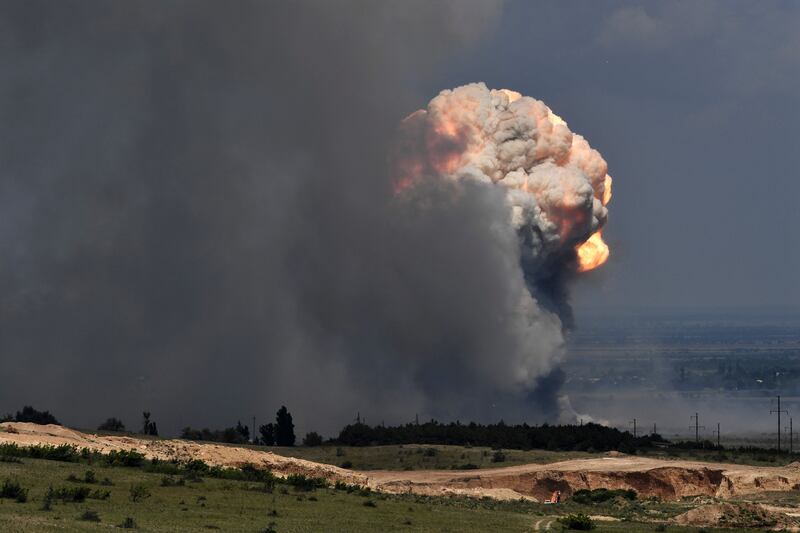 A plume of smoke rises over an ammunition depot where explosions occurred at the facility in Kirovsky district in Crimea on July 19th. Photograph: Viktor Korotayev/Kommersant Publishing House via AP