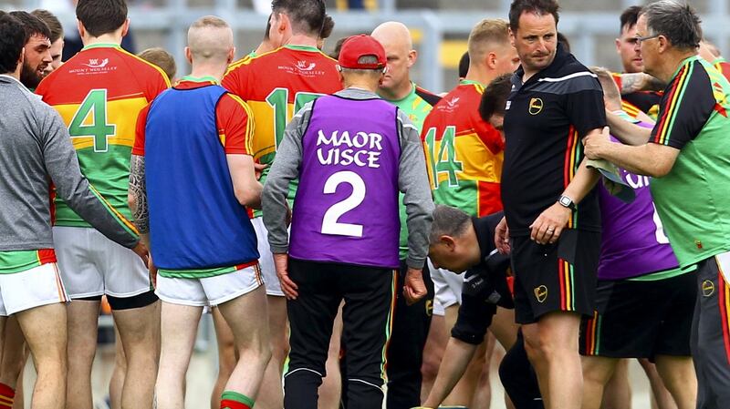 Carlow coach Steven Poacher with the team at half time. Photograph: Ken Sutton/Inpho
