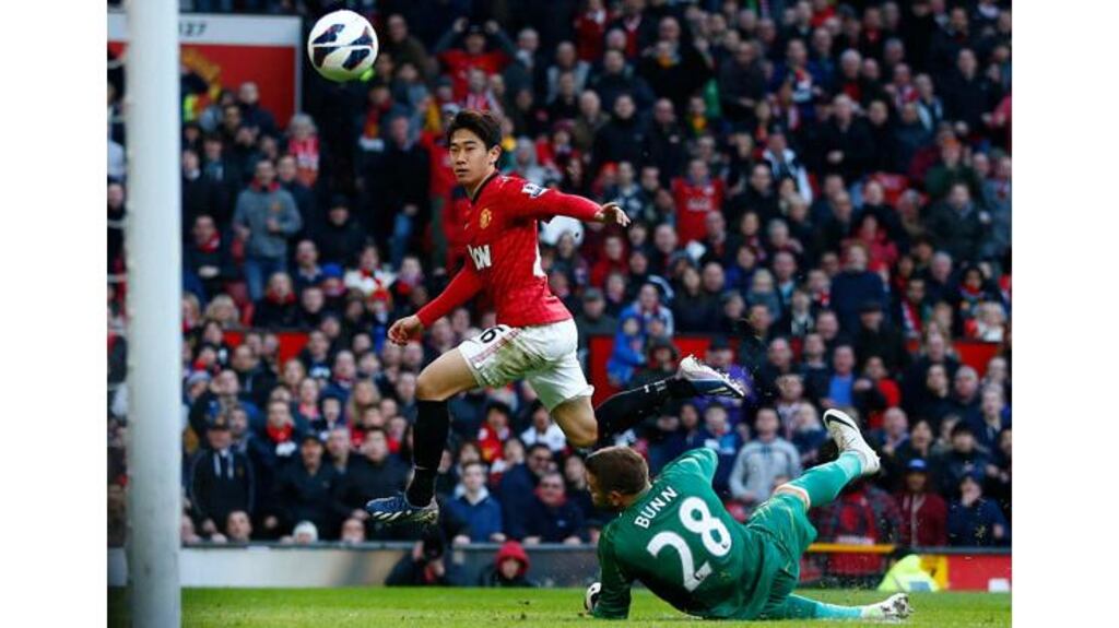 Manchester United's Shinji Kagawa scores his third goal past Norwich City's Mark Bunn at Old Trafford. Photograph: Darren Staples/Reuters