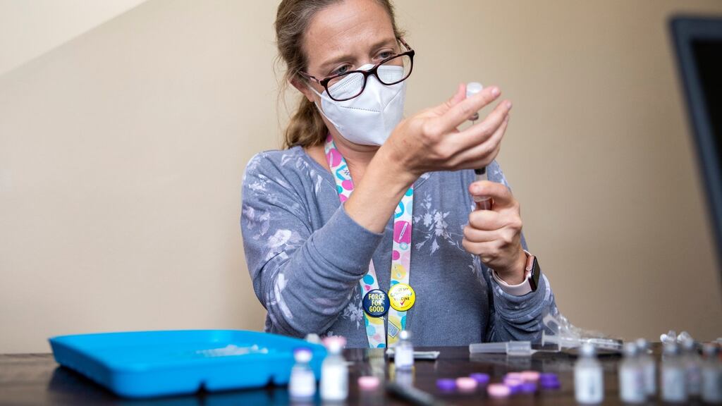 A healthcare worker prepares a Pfizer-BioNTech coronavirus vaccine at a mobile vaccine clinic in the US last month. Photograph: Alisha Jucevic/The New York Times