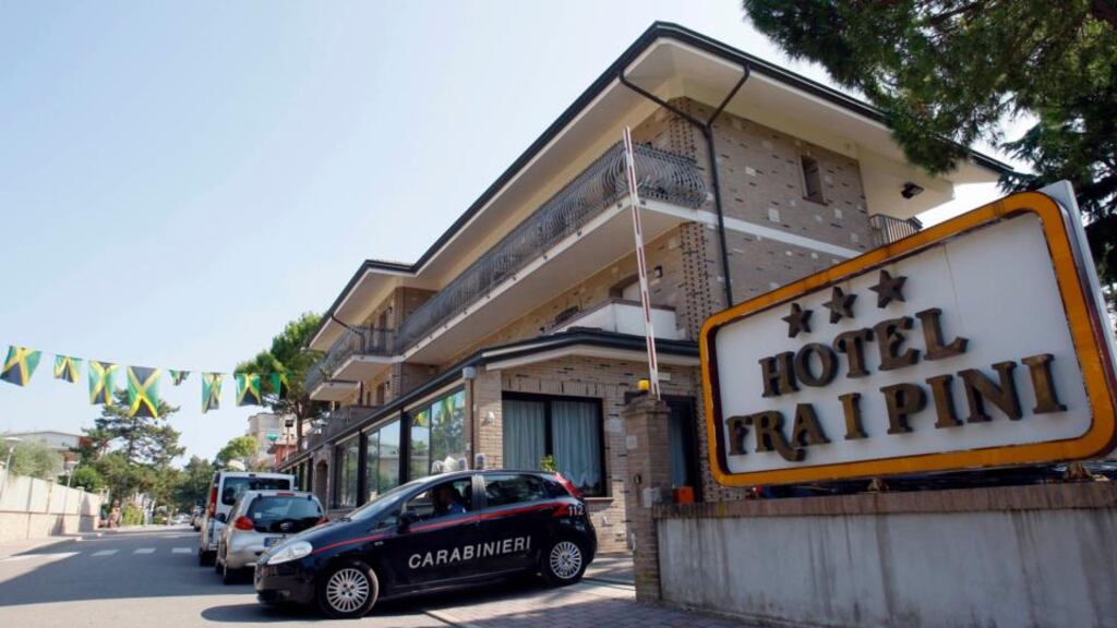 Italian police officers leave the Fra i Pini hotel where Jamaican sprinters Asafa Powell and Sherone Simpson stayed. Photograph: Alessandro Garofalo/Reuters