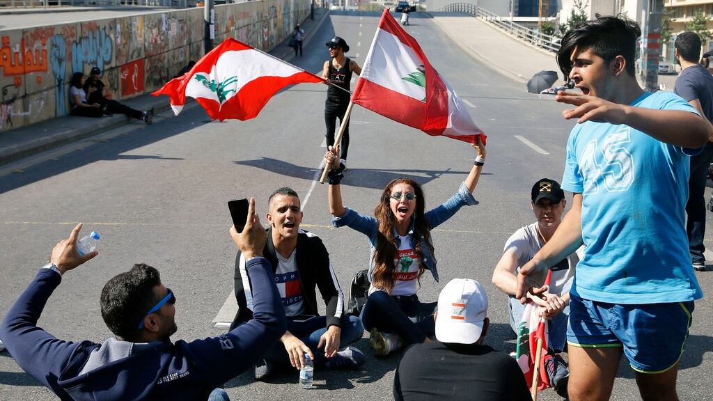Anti-government protesters  block a main highway in Beirut, Lebanon, on Monday. Photograph: Bilal Hussein/AP