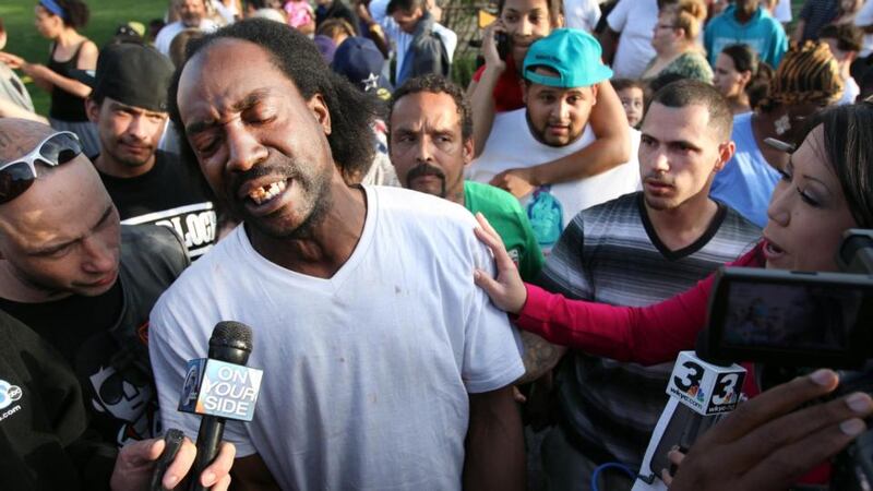 Charles Ramsey speaks to media near the home on Seymour Avenue in Clevland, Ohio, where three missing women were rescued on Monday. Photograph: AP Photo/The Plain Dealer, Scott Shaw