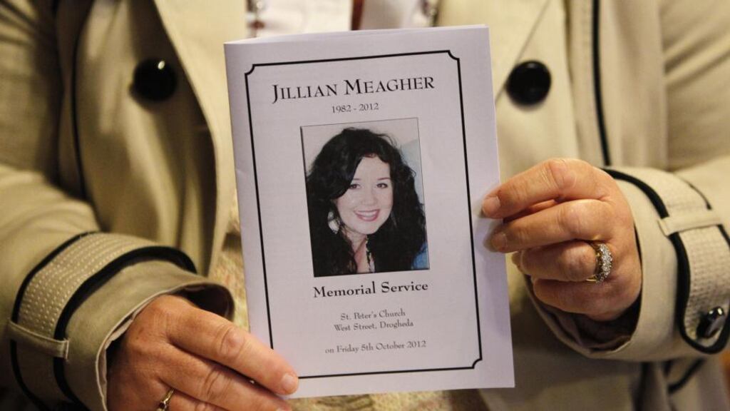A mass card displaying a portrait of Jill Meagher during a memorial mass in St Peters Catholic church in Drogheda last October 5. Photograph: Getty