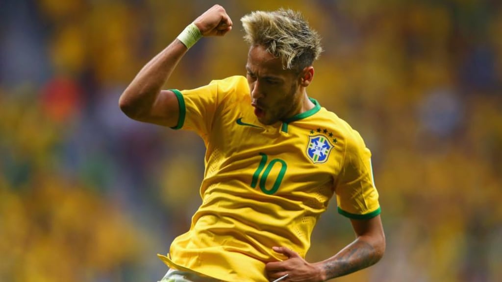 Neymar of Brazil celebrates scoring his team’s second goal in the World Cup Group A against Cameroon at Estadio Nacional in Brasilia. Photograph: Clive Brunskill/Getty Images