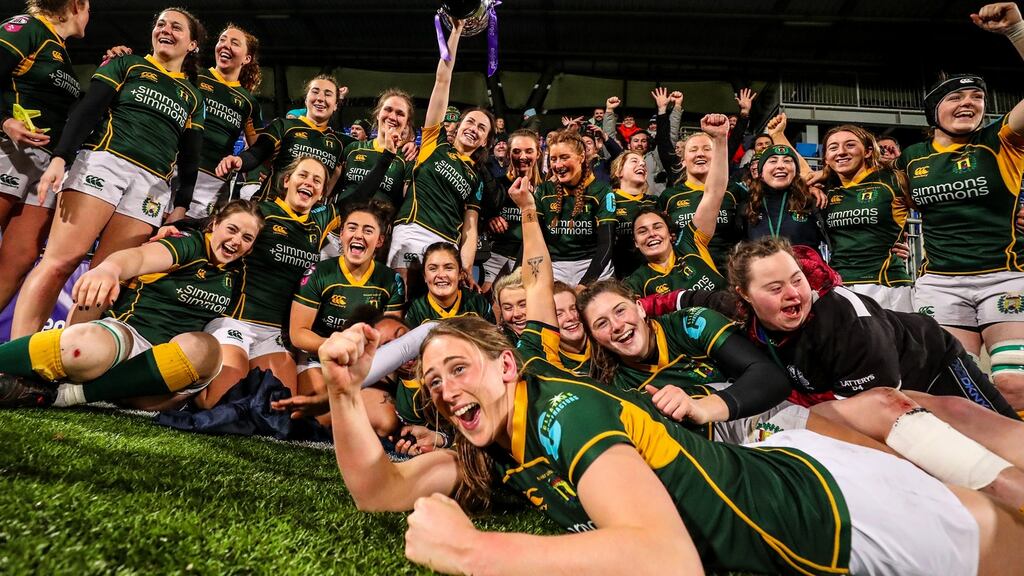 Railway celebrate with the trophy after seeing off Blackrock. Photograph: Ben Brady/Inpho