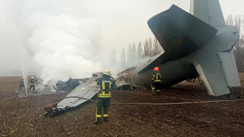 Emergency services working at the crash site of a Ukrainian military plane, in the Obukhiv district, near Kiev. Photograph: State Emergency Service of Ukraine - Handout/EPA