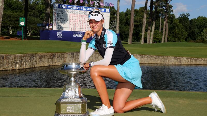 Nelly Korda poses with the trophy after her victory in the KPMG Women’s PGA Championship. Photograph: Kevin C Cox/Getty