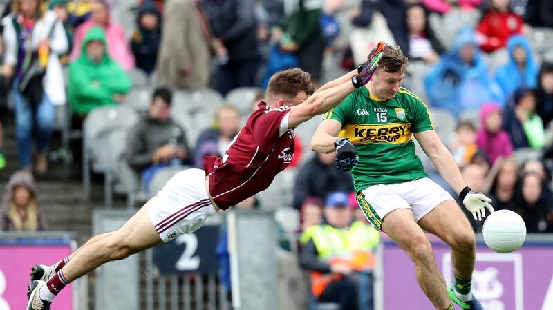 Galway’s Eoghan Kerin blocks down Kerry’s James O’Donoghue. Photo: Oisin Keniry/Inpho