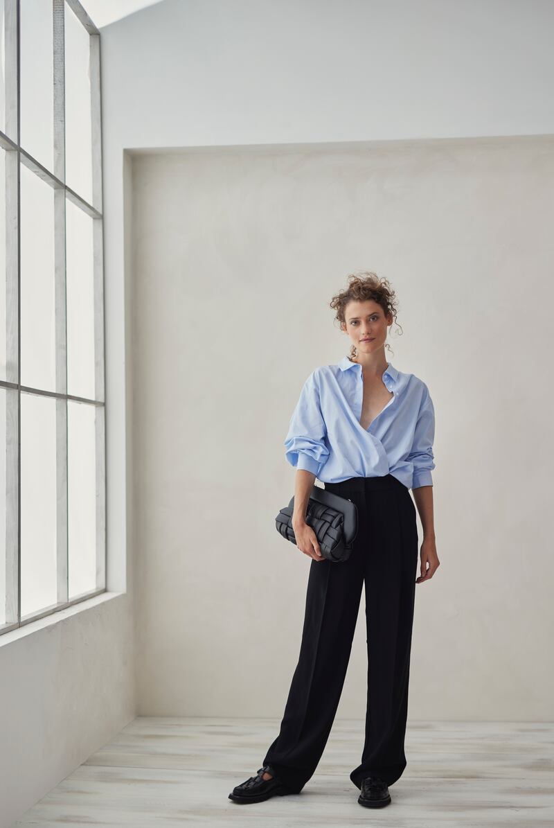 Organic cotton striped shirt €190, black wide leg crepe pant €240, Stylein vegan leather woven bag €405 by Themoire. Photograph: Dylan Madden