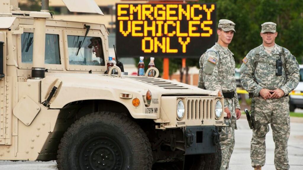 Missouri national guard soldiers stand by at a police command post in Ferguson, Missouri, yesterday. Photograph: Reuters/Mark Kauzlarich