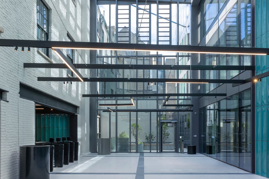 Number 20 Kildare Street has a new triple-height glazed atrium connecting its street-side buildings and reception to courtyards and seven stories of grade-A office space