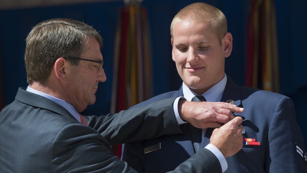 US Secretary of Defense Ashton Carter presents the Airman’s Medal to Airman 1st Class Spencer Stone for his role in disarming a gunman on a Paris-bound train during a ceremony at the Pentagon in Washington. Photograph: Saul Loeb/AFP/Getty Images