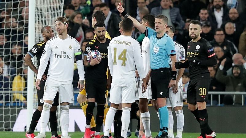 Referee Daniele Orsato sends off Real Madrid’s  Sergio Ramos during the  Champions League round of 16 first leg match at the Bernabeu. Photograph: Gonzalo Arroyo Moreno/Getty Images
