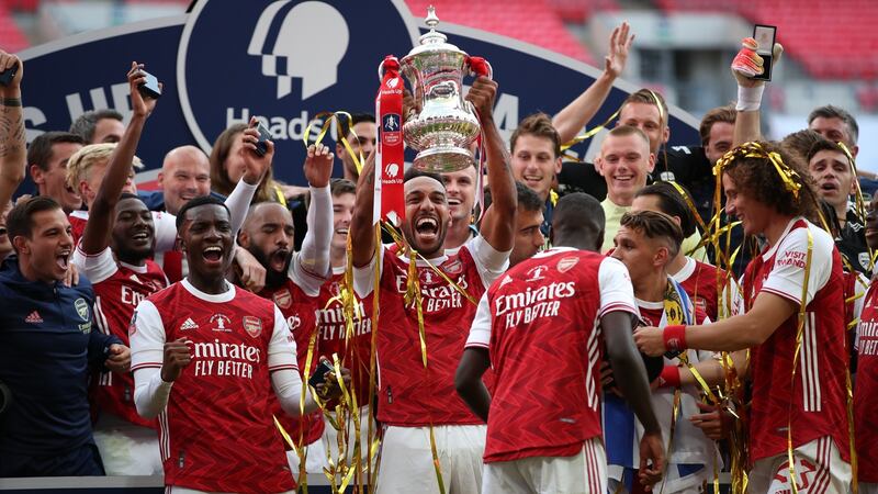 Pierre-Emerick Aubameyang lifts the FA Cup at Wembley Stadium. Photograph: Getty Images