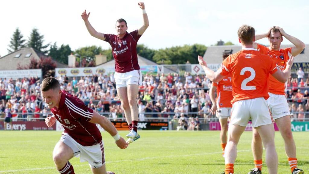 Galway’s Danny Cummins celebrates scoring his side’s opening goal with Michael Martin. Photograph: James Crombie/Inpho