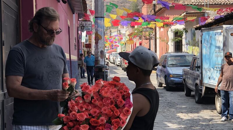 ‘Catching a glimpse of the man I love buying roses on a street festooned with papel picado, I knew I was home.’