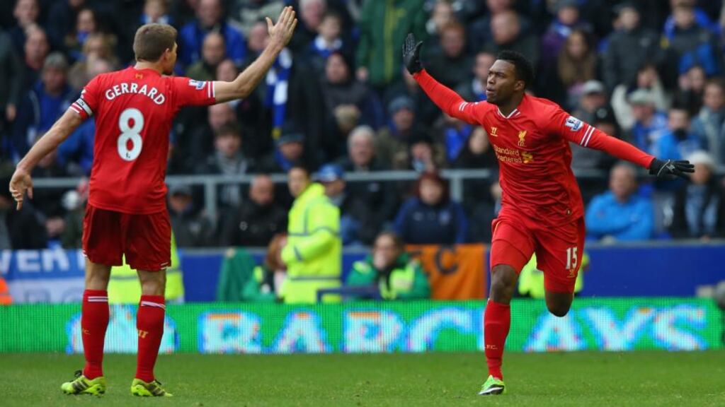 Daniel Sturridge celebrates with Steven Gerrard scoring his team’s third goal during the Premier League match between Everton and Liverpool at Goodison Park. Photograph: Alex Livesey/Getty Images