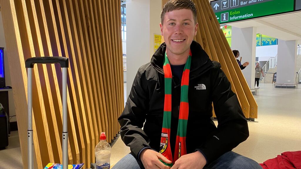 Mayo fan Niall Moran, who flew from London, at Knock airport. ‘I promised I’d come over if we beat Dublin, so that’s exactly what I did,’ he said. Photograph: David O’Connor
