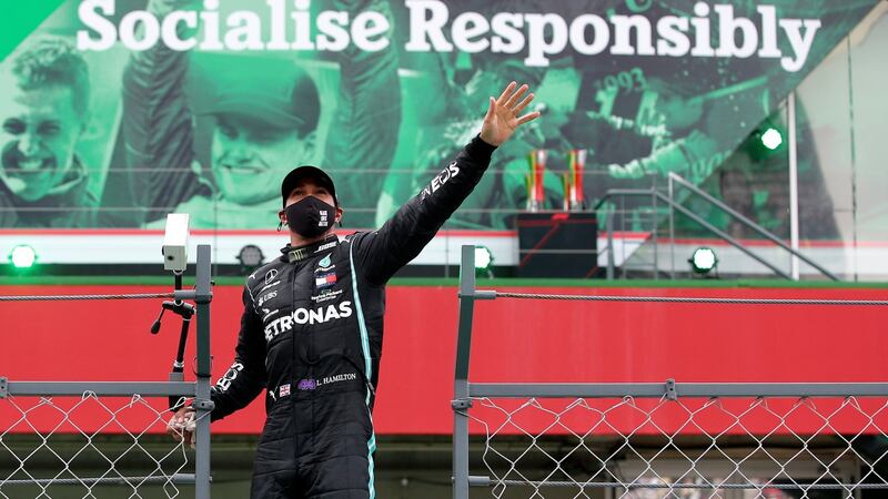 Lewis Hamilton celebrates after his record 92nd Grand Prix victory in Portugal. Photograph: Jose Sena Goulao/AP