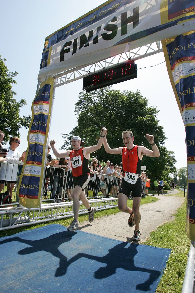 Seamus Bracken and Paul McCoole from the Midland Tri Club finish the Tri Athy. Photograph: Alan Betson