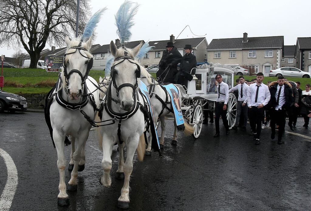 A horse-drawn carriage carries the coffin of Christopher Stokes in Ballinfoyle, Co. Galway, a day after his friend John Keenan Sammon's funeral. Photograph: Hany Marzouk