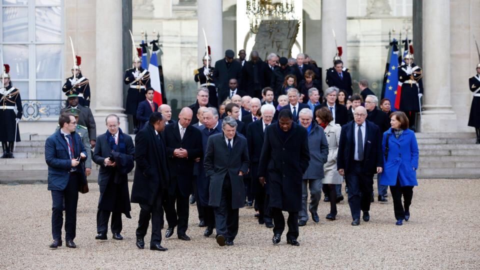 The presidents and politicians invited by French president Francois Hollande leave the Elysée Palace to participate in a march to honor the victims of the terrorist attacks in Paris on Sunday. Photograph: EPA