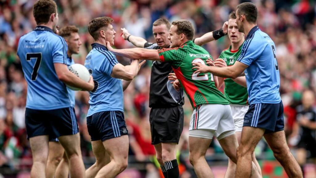 Referee Joe McQuillan awards Mayo a penalty on Sunday. With no help from a TMO, a ref must depend on linesmen who pick up only half of what’s going on and umpires who are just along for the ride. Photograph: James Crombie/Inpho