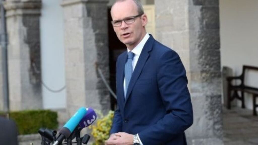 Simon Coveney: “There are strong views on issues like how you legislate for the Irish language.” File photograph: Dara Mac Dónaill